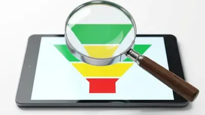 Magnifying glass examining a CRM sales funnel on a tablet screen